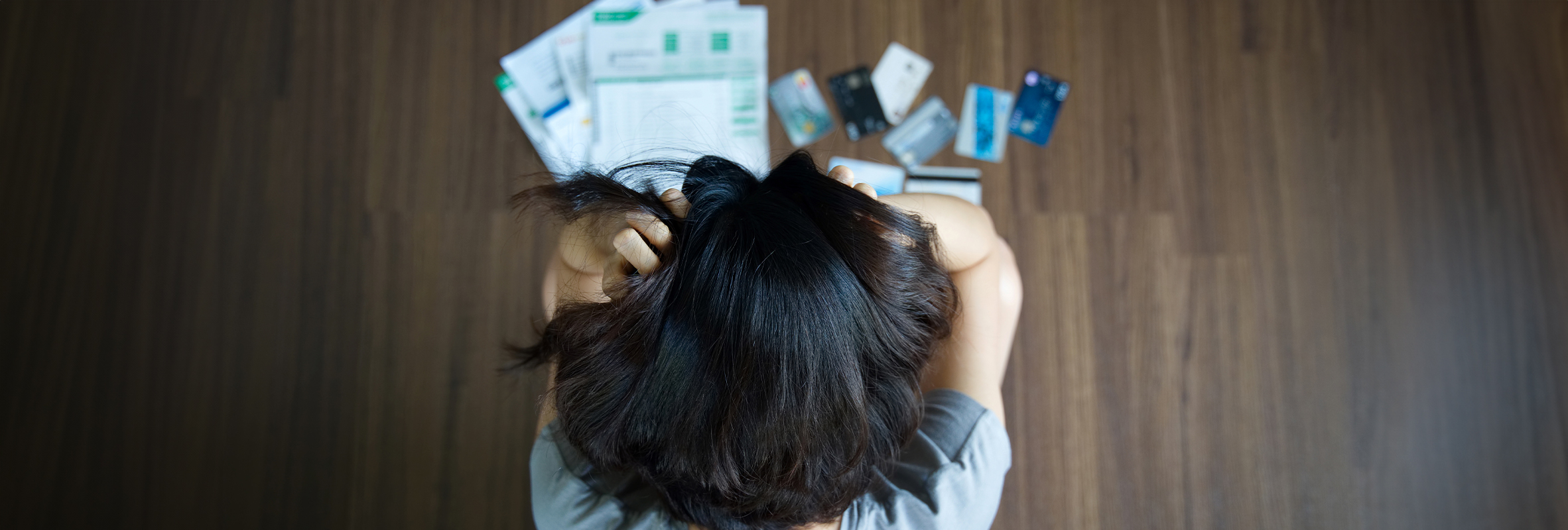 lady visibly stressed about debt