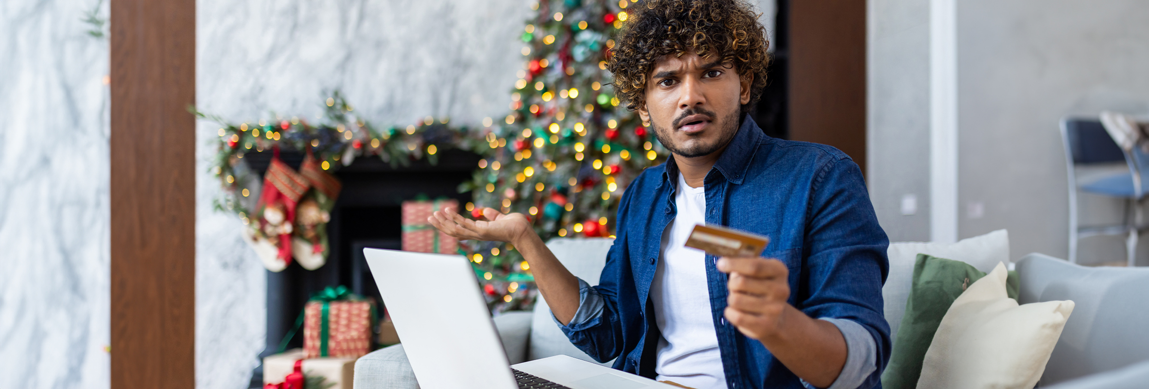 man looking at credit card