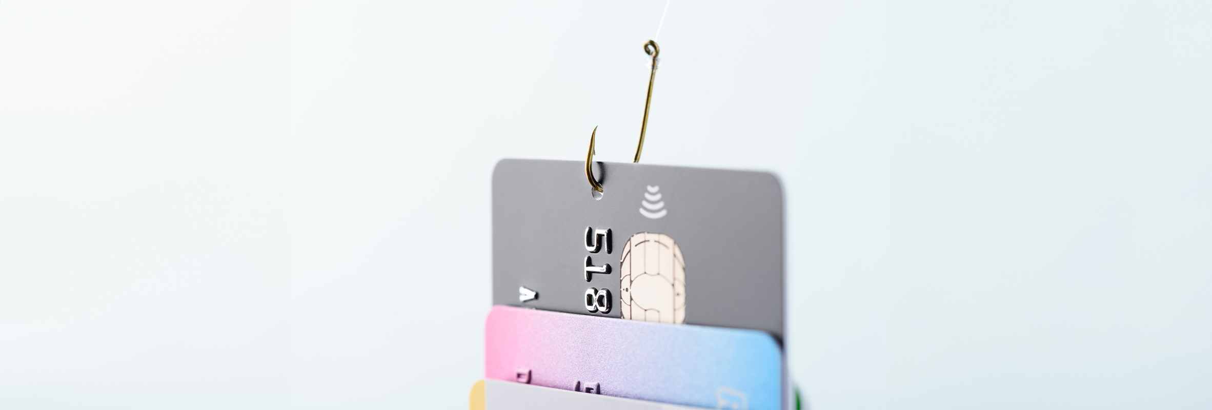 Fishing hook through debit cards